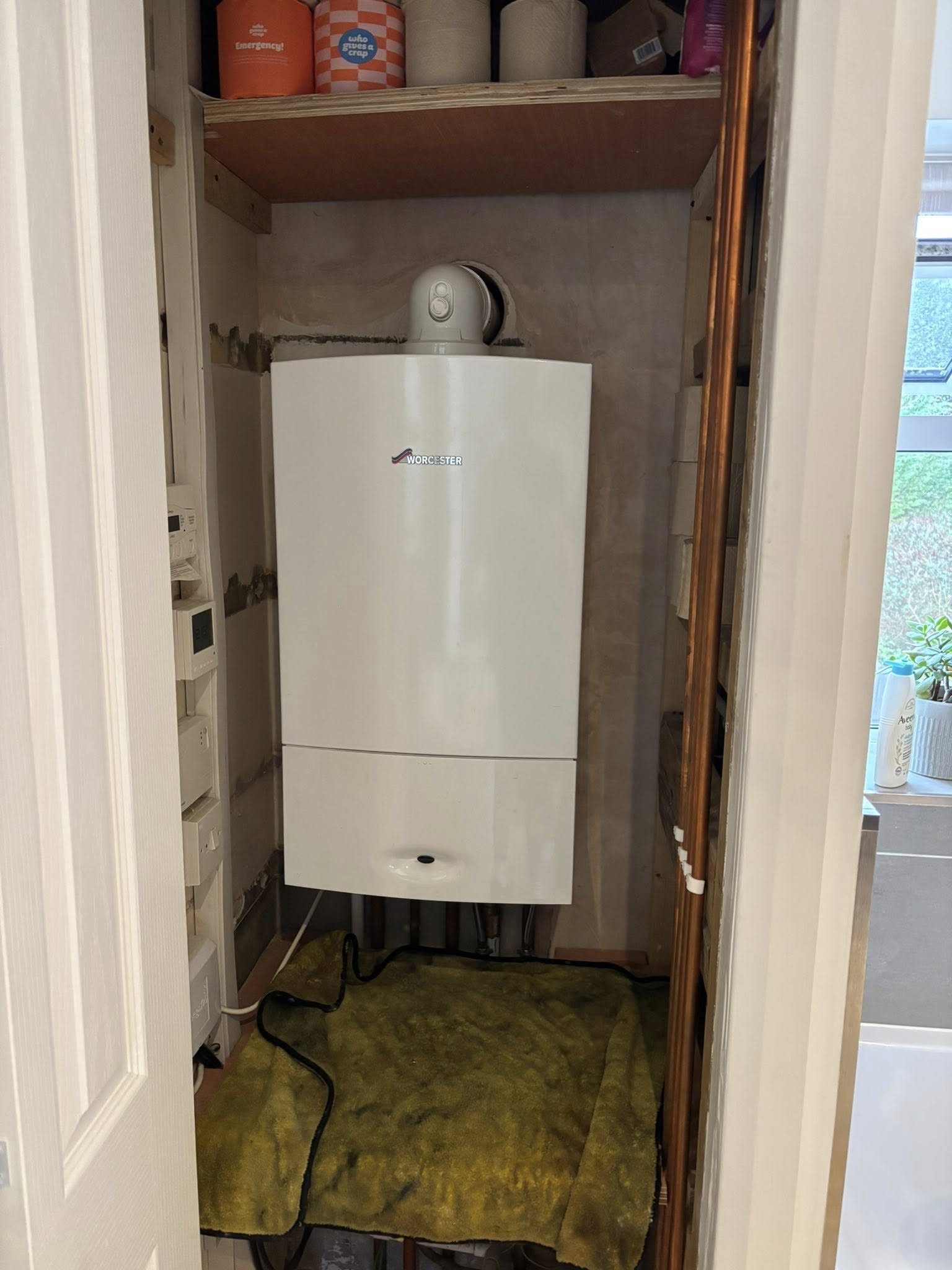 Gas Safe registered engineer from Surrey Boiler & Plumbing Services completing a boiler installation in Croydon